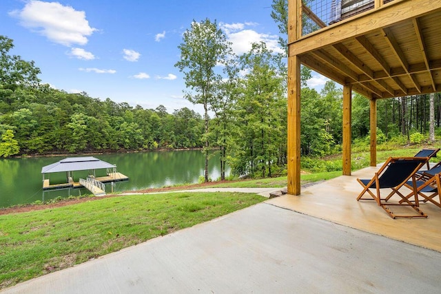 view of patio with a water view and a boat dock