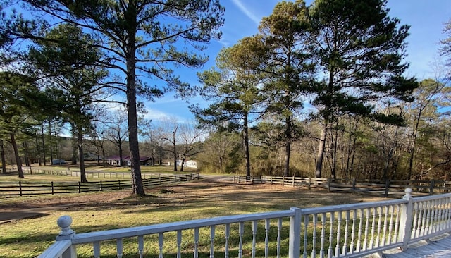 view of yard featuring a rural view and fence