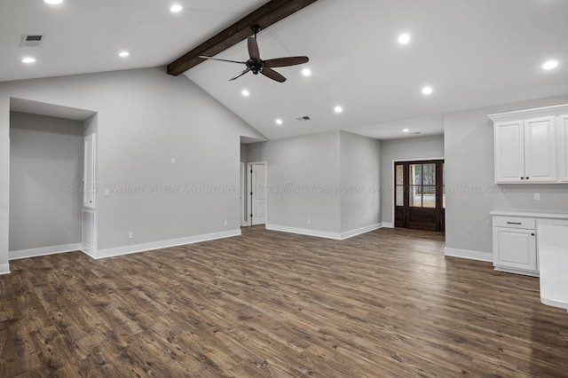 unfurnished living room with lofted ceiling with beams, ceiling fan, and dark hardwood / wood-style flooring