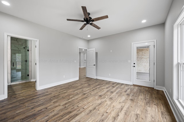 unfurnished bedroom with hardwood / wood-style flooring, access to outside, connected bathroom, and ceiling fan