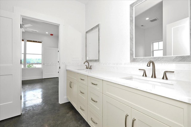 bathroom featuring vanity, concrete floors, and ceiling fan