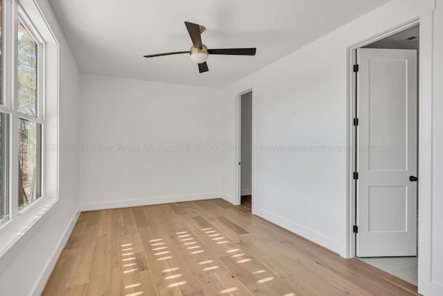 unfurnished room featuring light wood-style flooring and baseboards