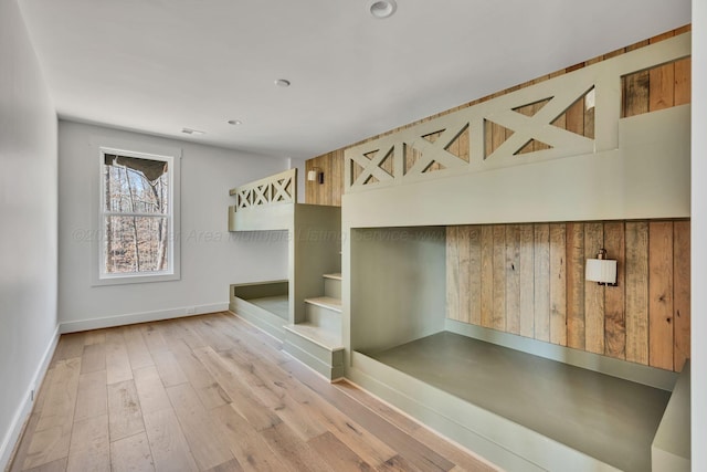 unfurnished bedroom featuring baseboards and wood finished floors