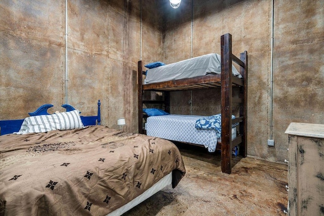 unfurnished bedroom featuring concrete floors