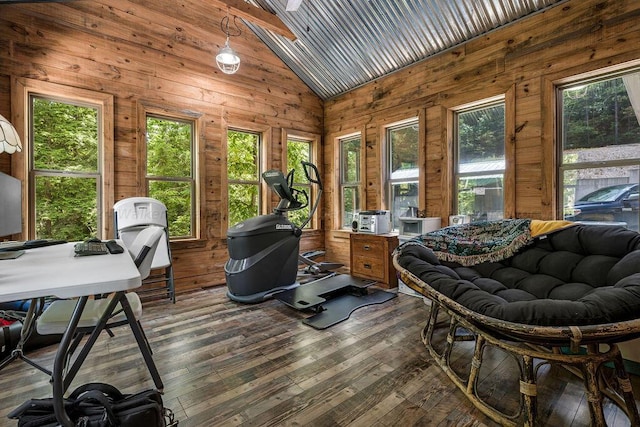 sunroom featuring vaulted ceiling and plenty of natural light