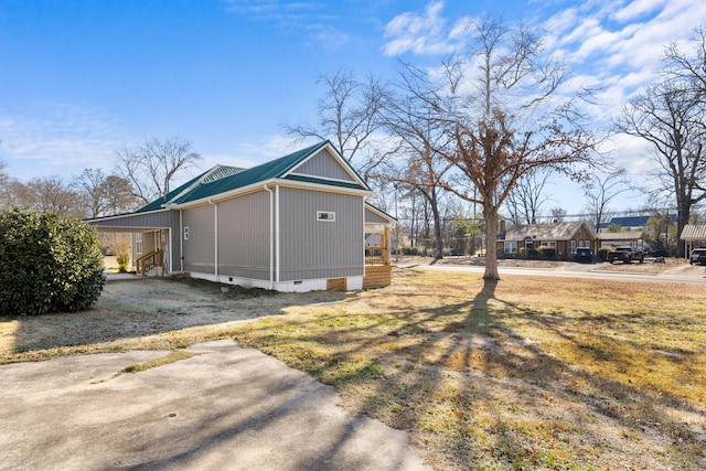 view of home's exterior featuring a carport