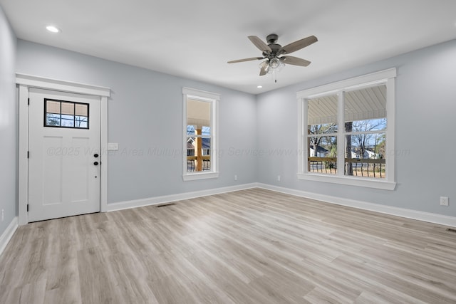 foyer featuring light hardwood / wood-style flooring, plenty of natural light, and ceiling fan