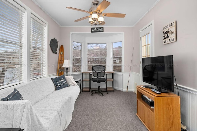 office featuring ceiling fan, light colored carpet, and crown molding