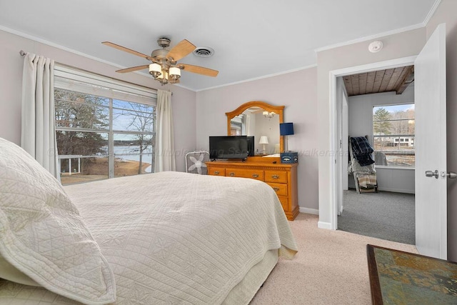 bedroom featuring ceiling fan, ornamental molding, and light colored carpet