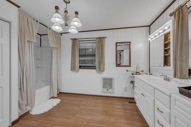 bathroom with shower / bathtub combination with curtain, hardwood / wood-style flooring, heating unit, and a textured ceiling