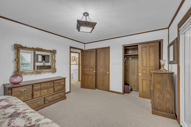 bedroom with crown molding, multiple closets, and a textured ceiling