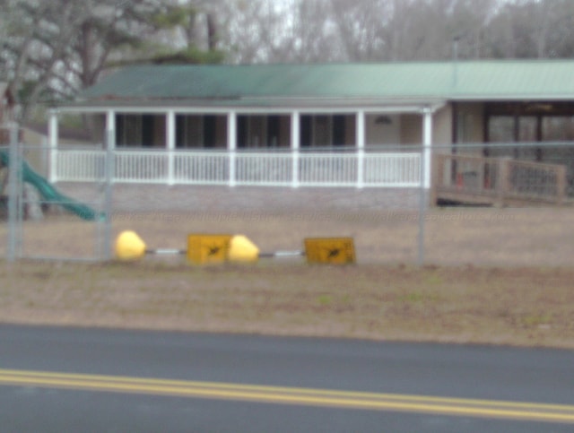 view of front of property featuring a playground