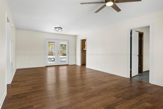 empty room with dark hardwood / wood-style flooring, french doors, and ceiling fan