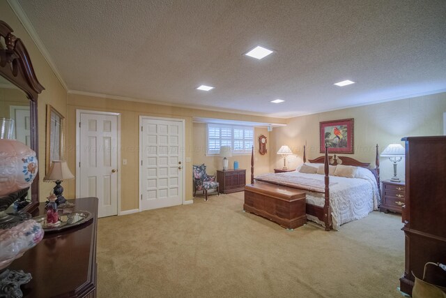 carpeted bedroom featuring crown molding and a textured ceiling