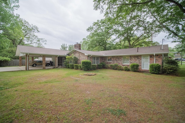 ranch-style home featuring a front yard and a carport