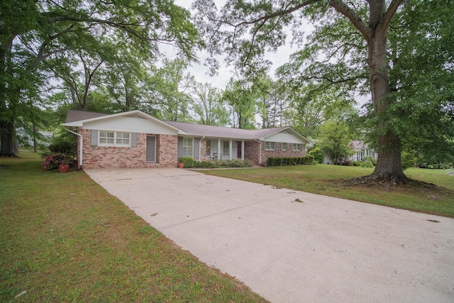 ranch-style house with a front lawn