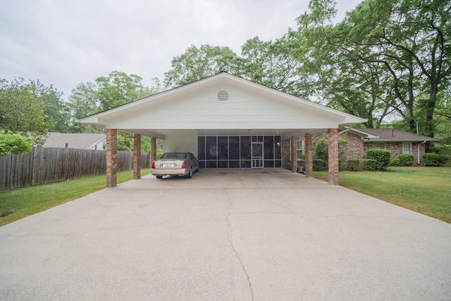 view of front of home with a front lawn and a carport