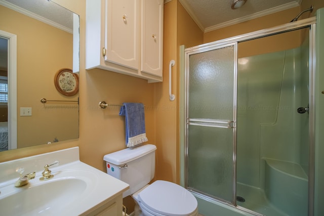 bathroom with vanity, a textured ceiling, crown molding, toilet, and a shower with shower door