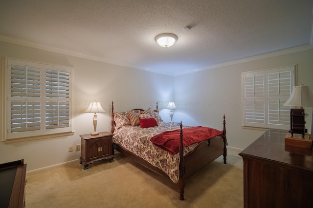 carpeted bedroom featuring ornamental molding and a textured ceiling