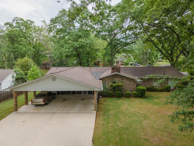 ranch-style house featuring a front yard and a carport