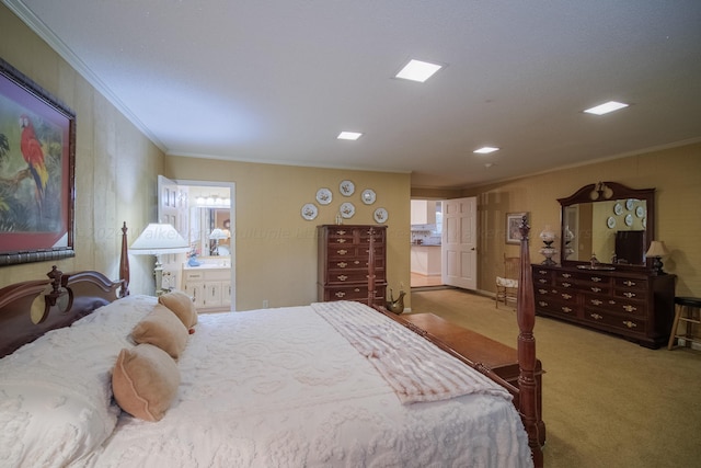 bedroom with carpet, ensuite bathroom, and crown molding