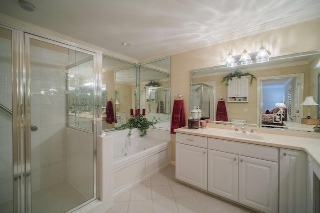 bathroom featuring tile patterned floors, vanity, ornamental molding, and shower with separate bathtub