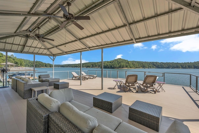 view of patio / terrace with a gazebo, an outdoor living space, and a water view