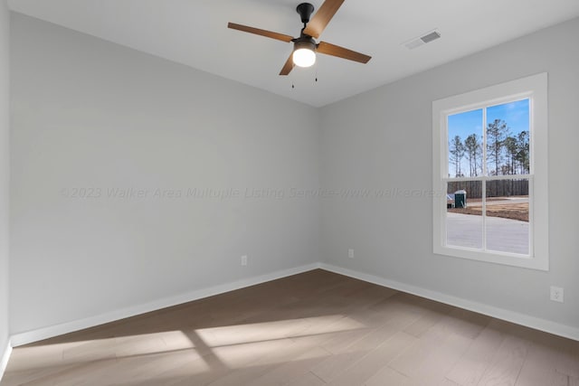 unfurnished room featuring hardwood / wood-style flooring and ceiling fan