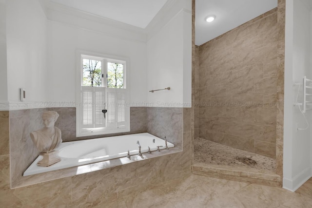 bathroom featuring ornamental molding and independent shower and bath