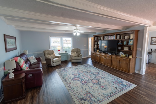 living room featuring dark wood finished floors, beamed ceiling, and baseboards