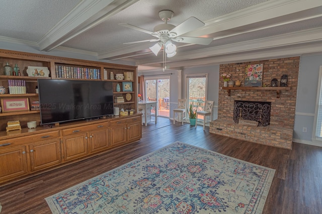 living room with a textured ceiling, dark wood-type flooring, a fireplace, beam ceiling, and crown molding