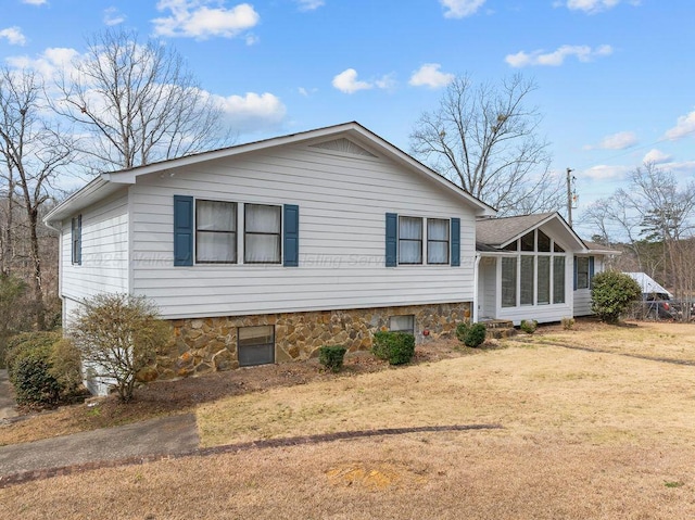 view of property exterior with a yard