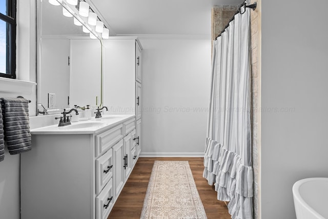 bathroom with ornamental molding, shower with separate bathtub, hardwood / wood-style floors, and vanity