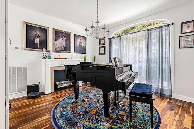 miscellaneous room featuring dark hardwood / wood-style flooring, crown molding, and a chandelier