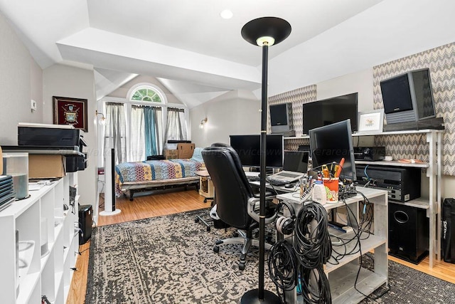 office space featuring lofted ceiling and wood-type flooring