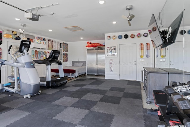 garage with stainless steel built in refrigerator, recessed lighting, and a garage door opener