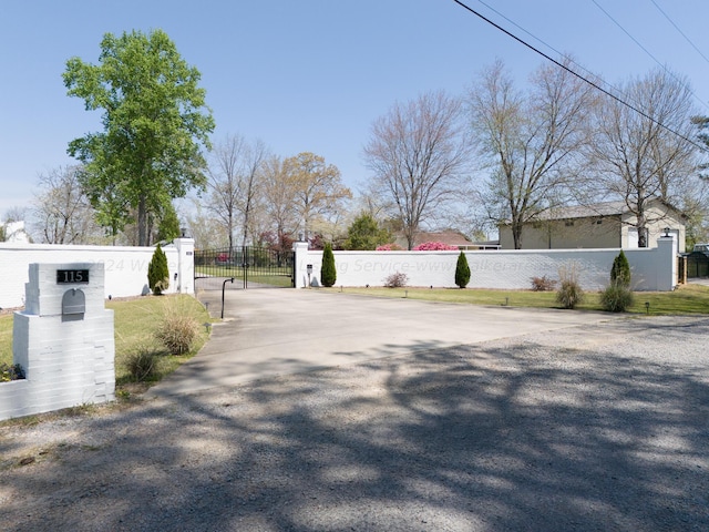 view of street featuring a gate