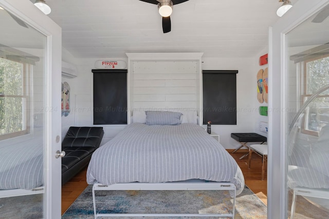 bedroom with wood finished floors and a ceiling fan