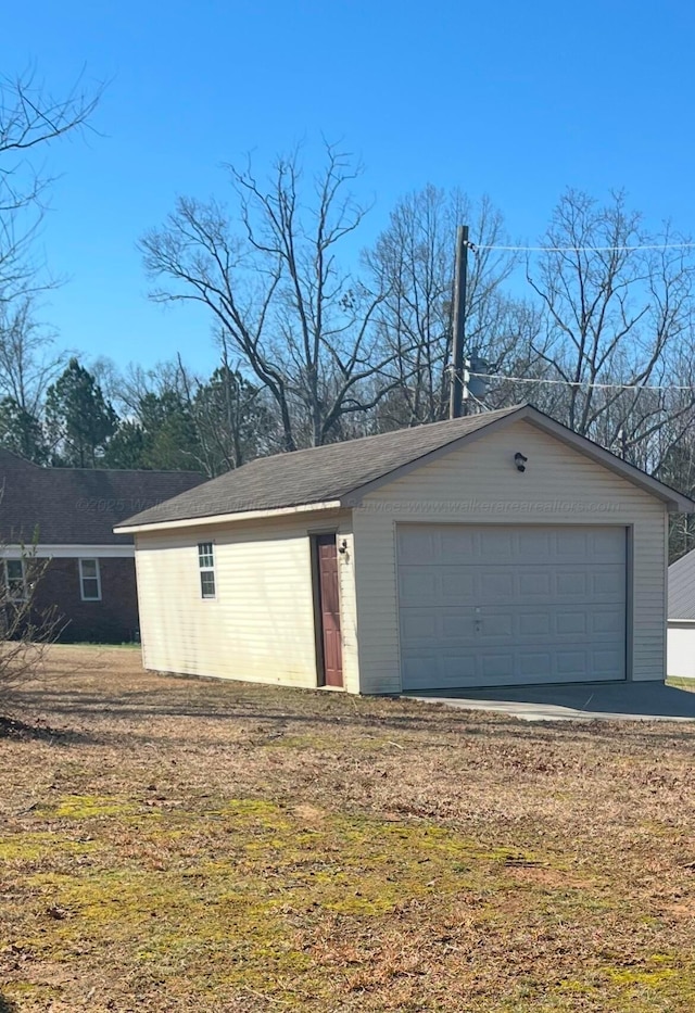 garage with a yard