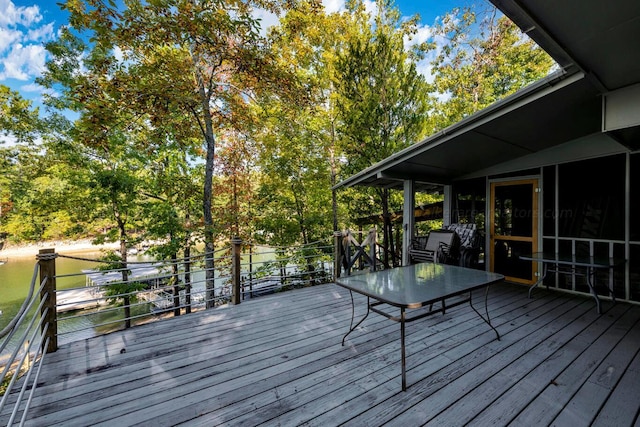 wooden deck with a sunroom