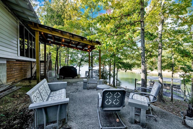 view of patio with a water view