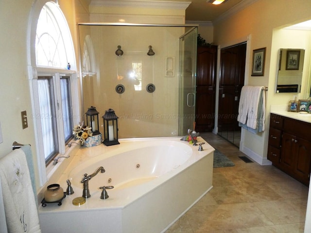 bathroom featuring crown molding, vanity, and shower with separate bathtub