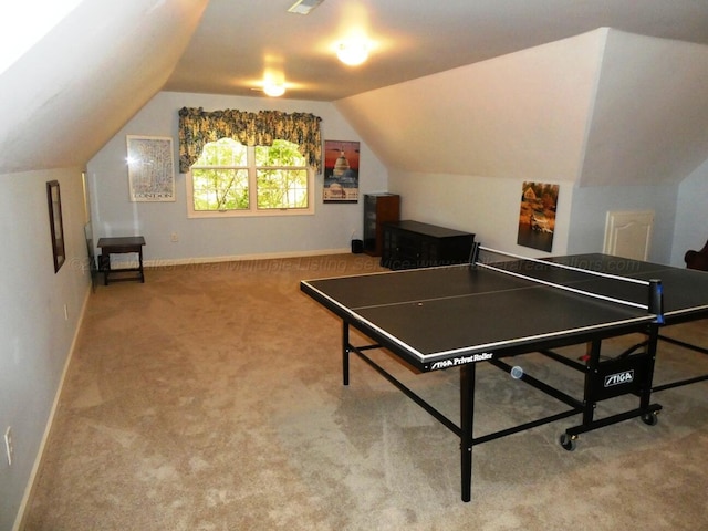 rec room featuring vaulted ceiling and carpet flooring