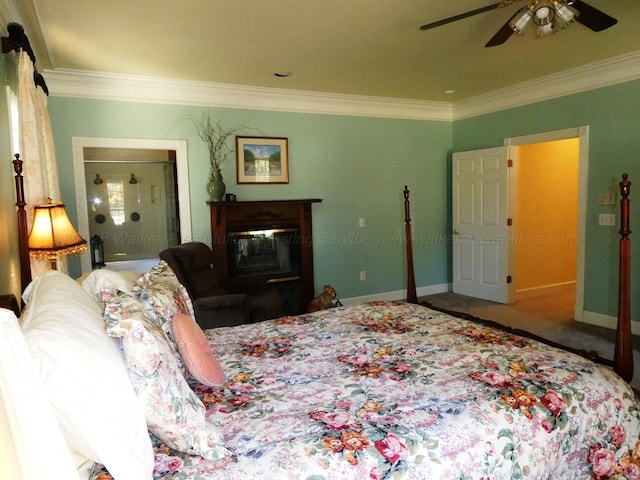 bedroom featuring ceiling fan, ornamental molding, and carpet floors