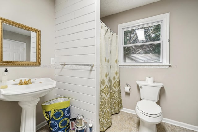 bathroom with sink and toilet