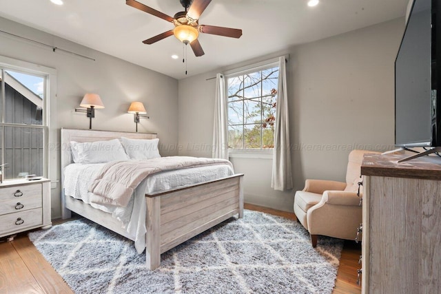 bedroom featuring ceiling fan and light wood-type flooring