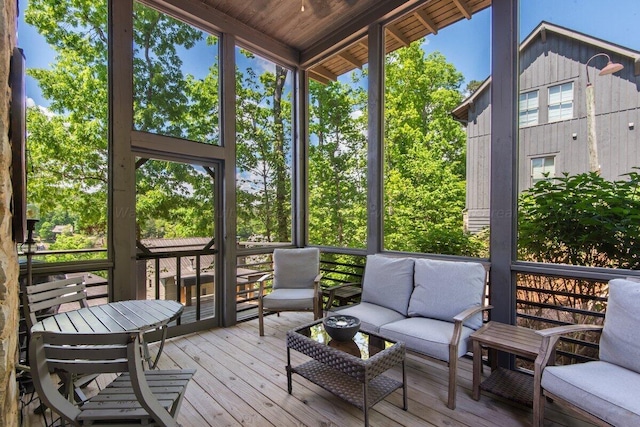 sunroom / solarium featuring a healthy amount of sunlight