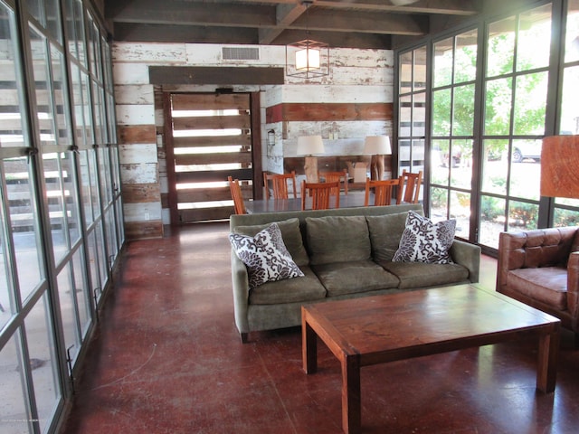 living room with wood walls