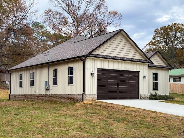 view of property exterior featuring a lawn and a garage