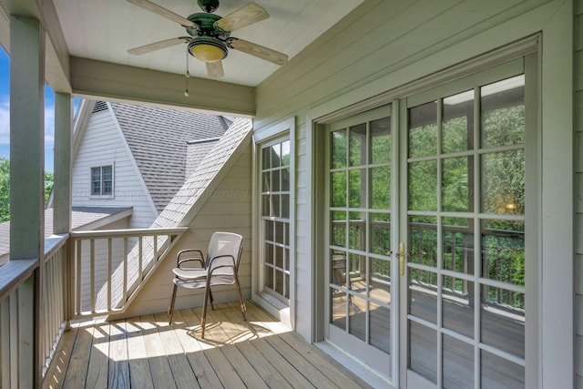 wooden terrace featuring ceiling fan